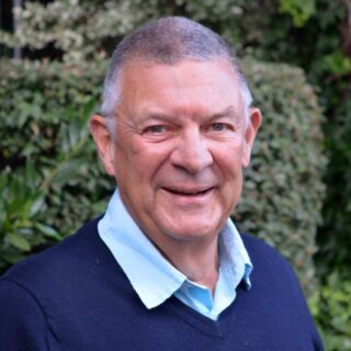 CAP trustee, Mark Sheard, wearing a blue jumper, smiling at the camera
