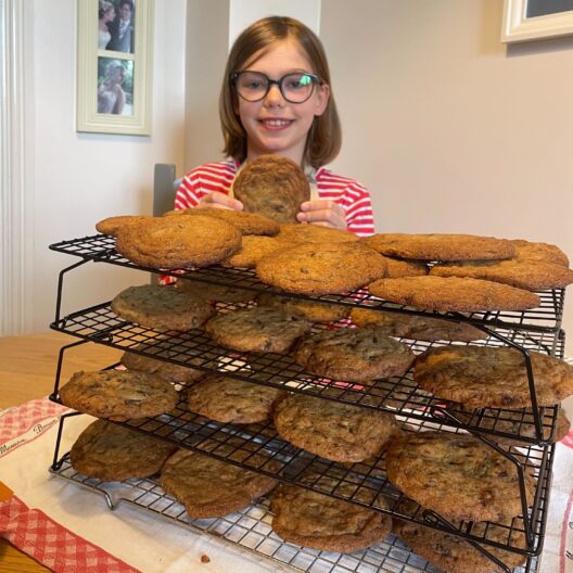 Bun sale fundraiser, Cleo, stood with cookies that she baked to raise money for CAP