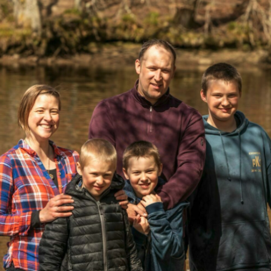 Jenny with her husband and three sons