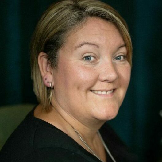 Headshot of female CAP client facing the camera and smiling