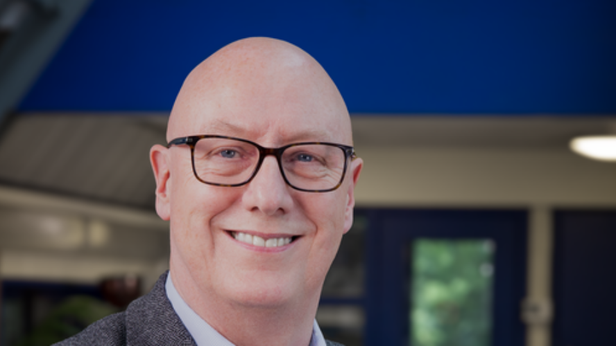 Stewart McCulloch, CEO of CAP UK, a white older male who is bald with glasses, smiling at the camera.