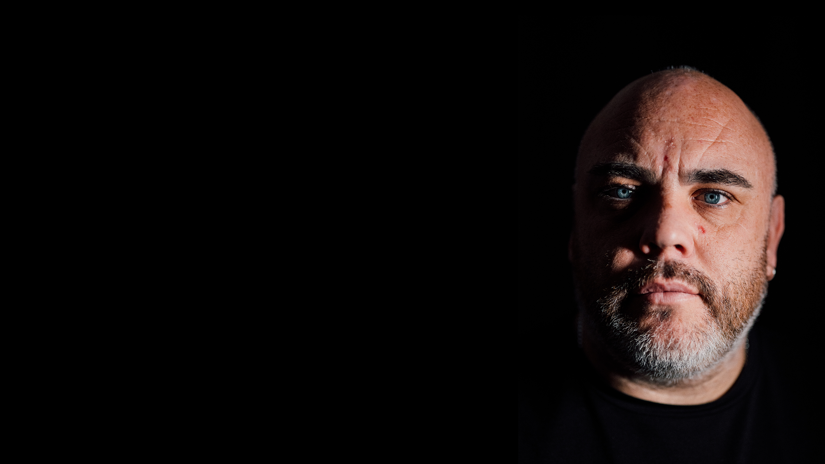 man's face on a black background