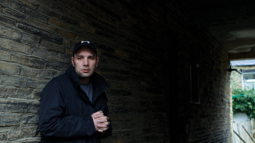 Man stood in a dark passage