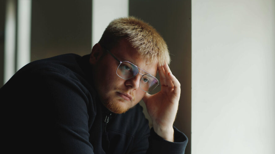 A man sitting with his head in his hands