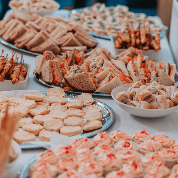 A buffet style spread of food, with trays of sandwiches and canapes. Photo by Matthew Leung (Tsz Lok Photos).