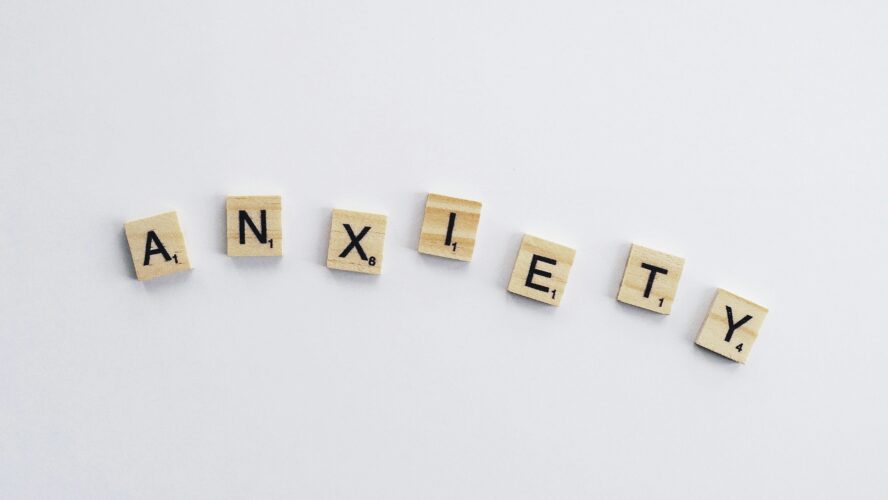 Scrabble letters that spell out the word 'anxiety'
