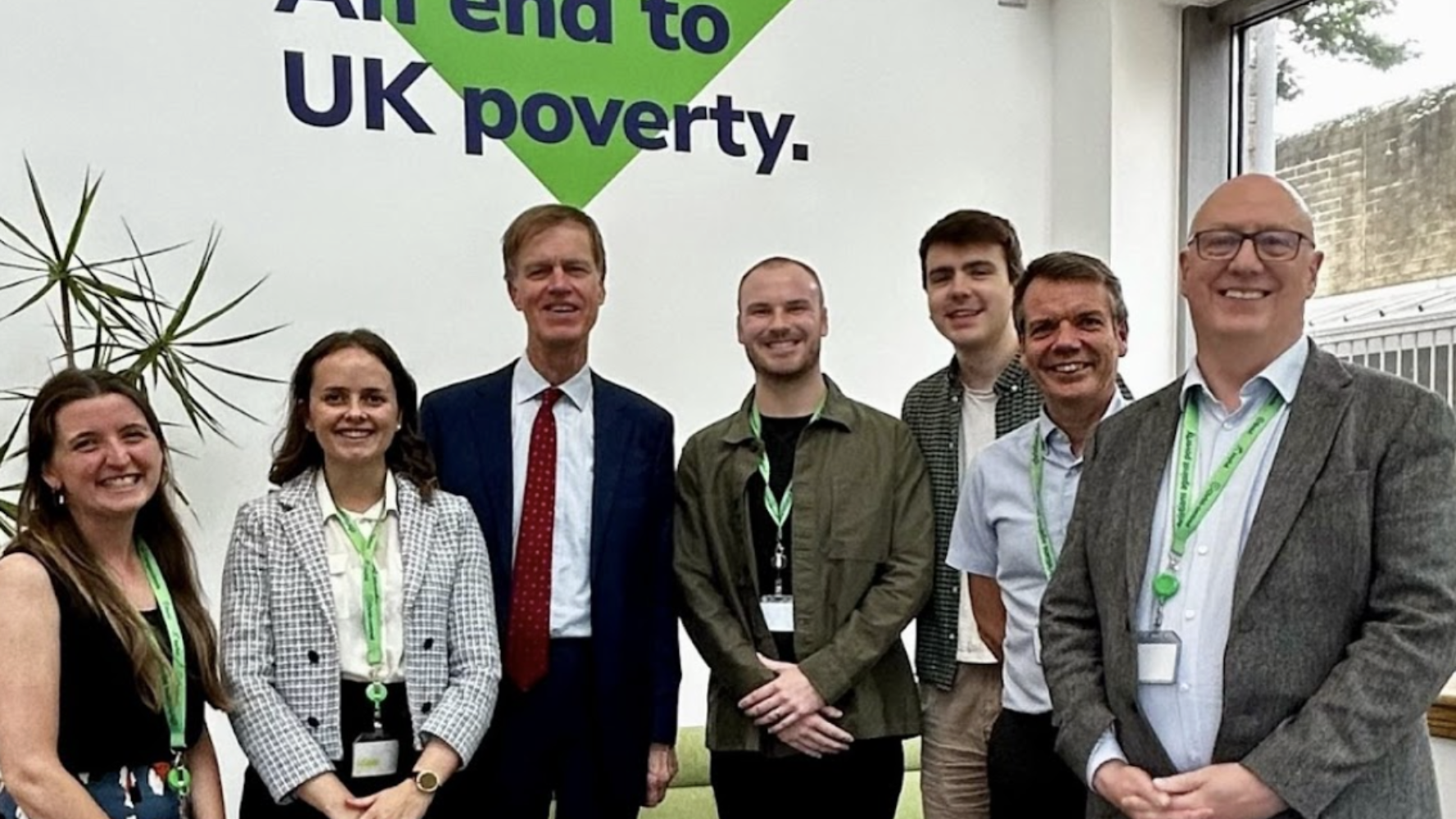 CAP staff, meeting with Sir Stephen Timms at CAP's Bradford support hub, smiling at the camera