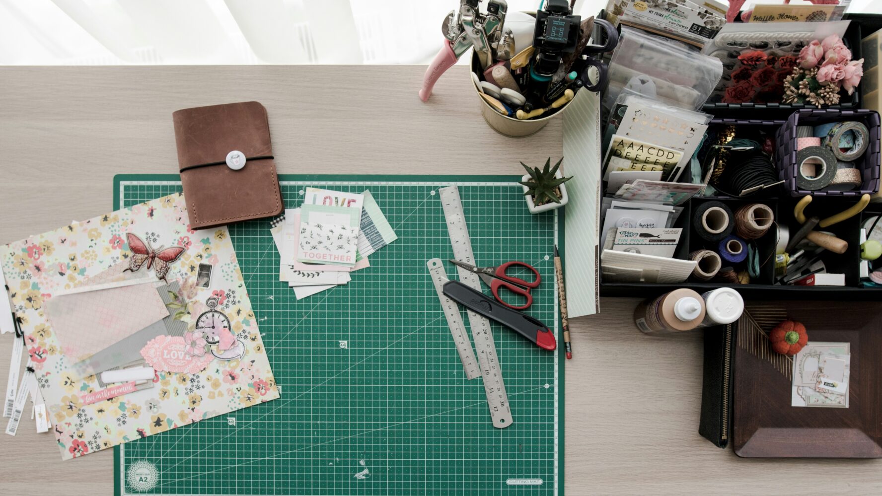 A craft table with a range of different paper crafts and materials