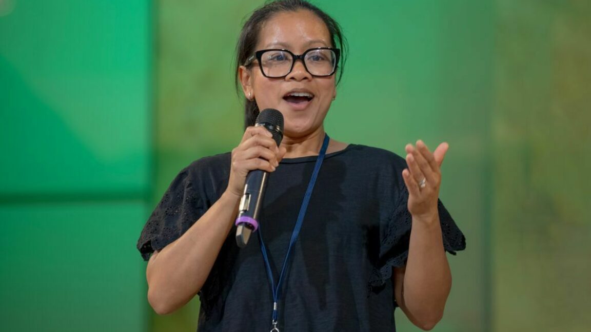 A female CAP service coach delivering a talk