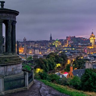 Bird's eye view of the city of Edinburgh at sunset including The Dugald Stewart Monument