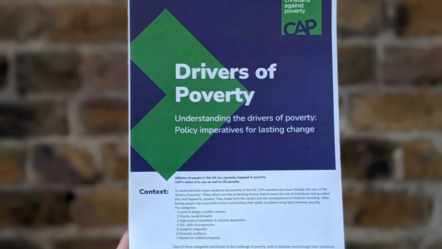 Drivers of poverty briefing in front of brick wall