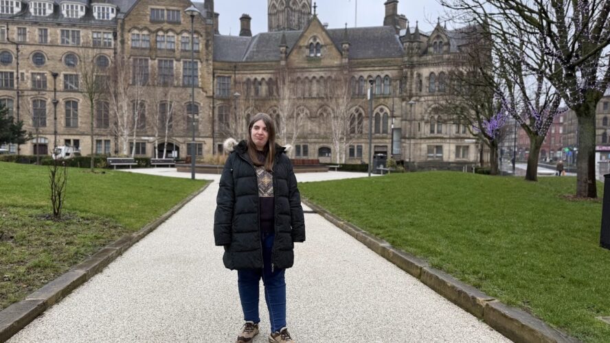 CAP employee, Amy, stood in Bradford centre in Winter smiling