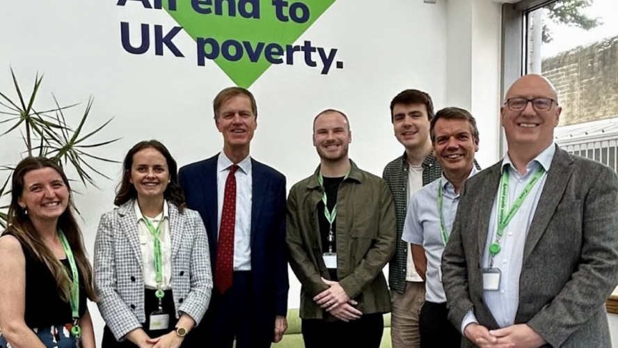 CAP staff, meeting with Sir Stephen Timms at CAP's Bradford support hub, smiling at the camera