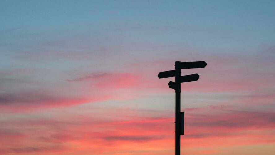 Shilouette of signpost at sunset.