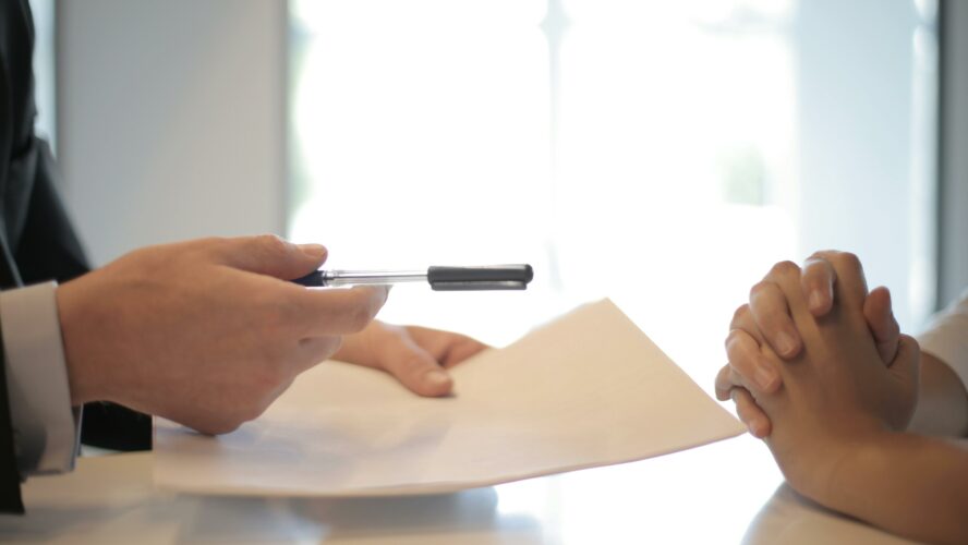 Two people looking at a document.