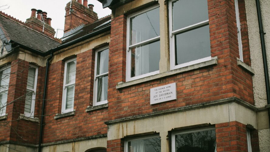 Close up of an old, red brick, terraced, British house.