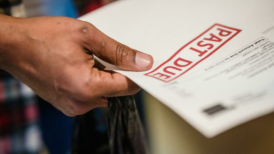 Someone holding a debt letter
