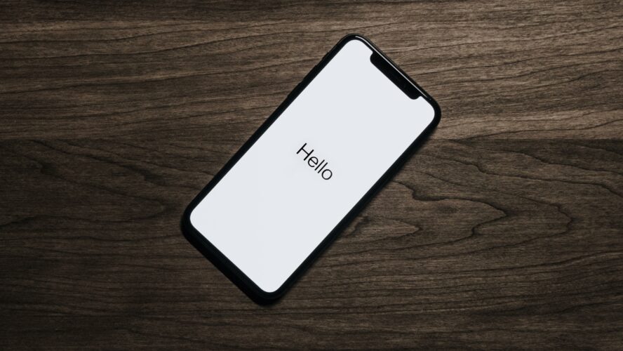 Iphone with the word hello on the screen.