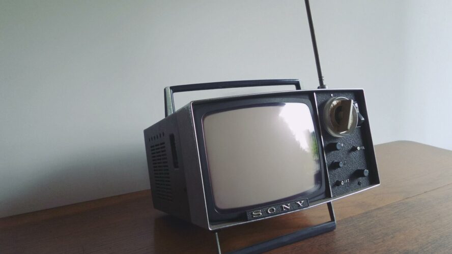 Old school TV set with antenna.