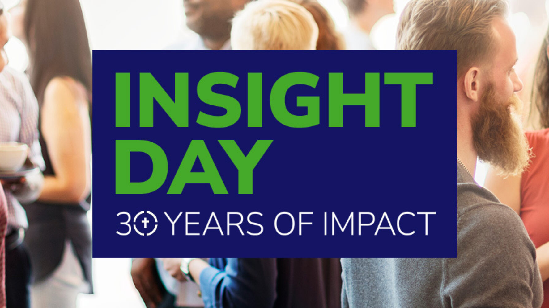 People at an event drinking coffee and talking to each other, with the banner that reads 'Insight Day: 30 years of impact'