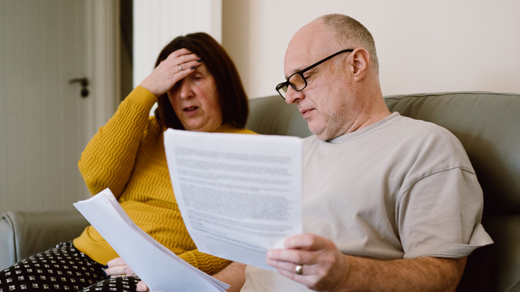 couple looking at bills