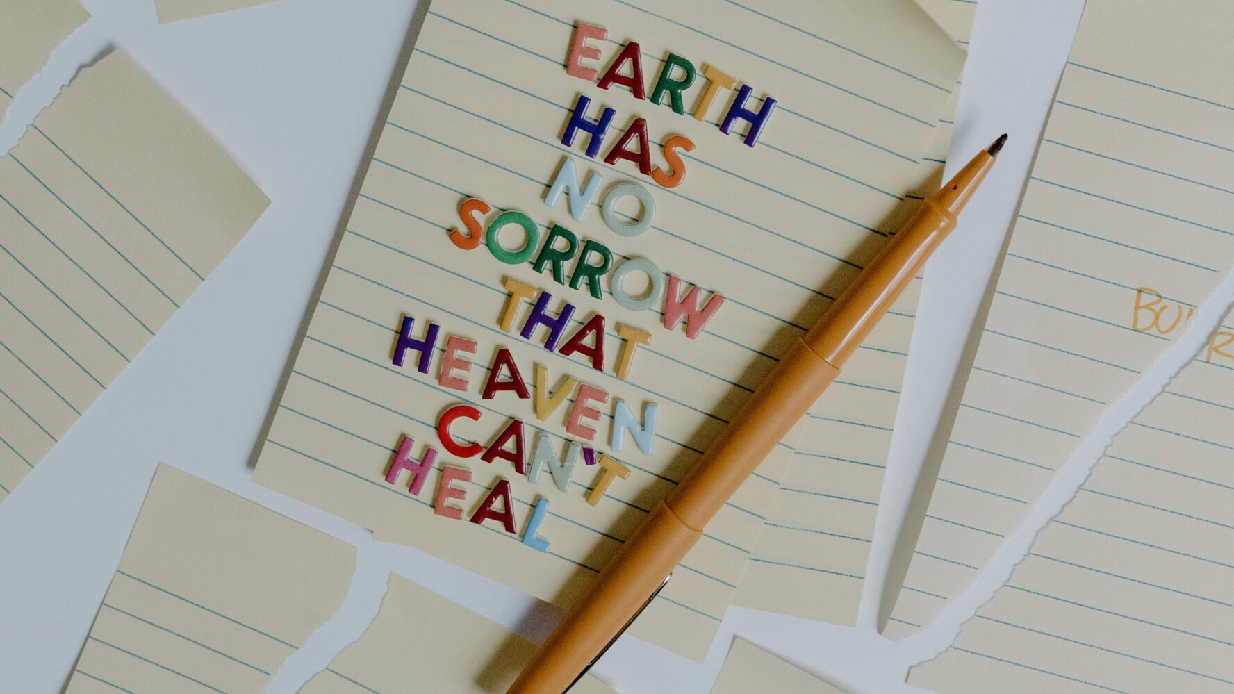 A note pad that says earth has no sorrow that heaven can't heal