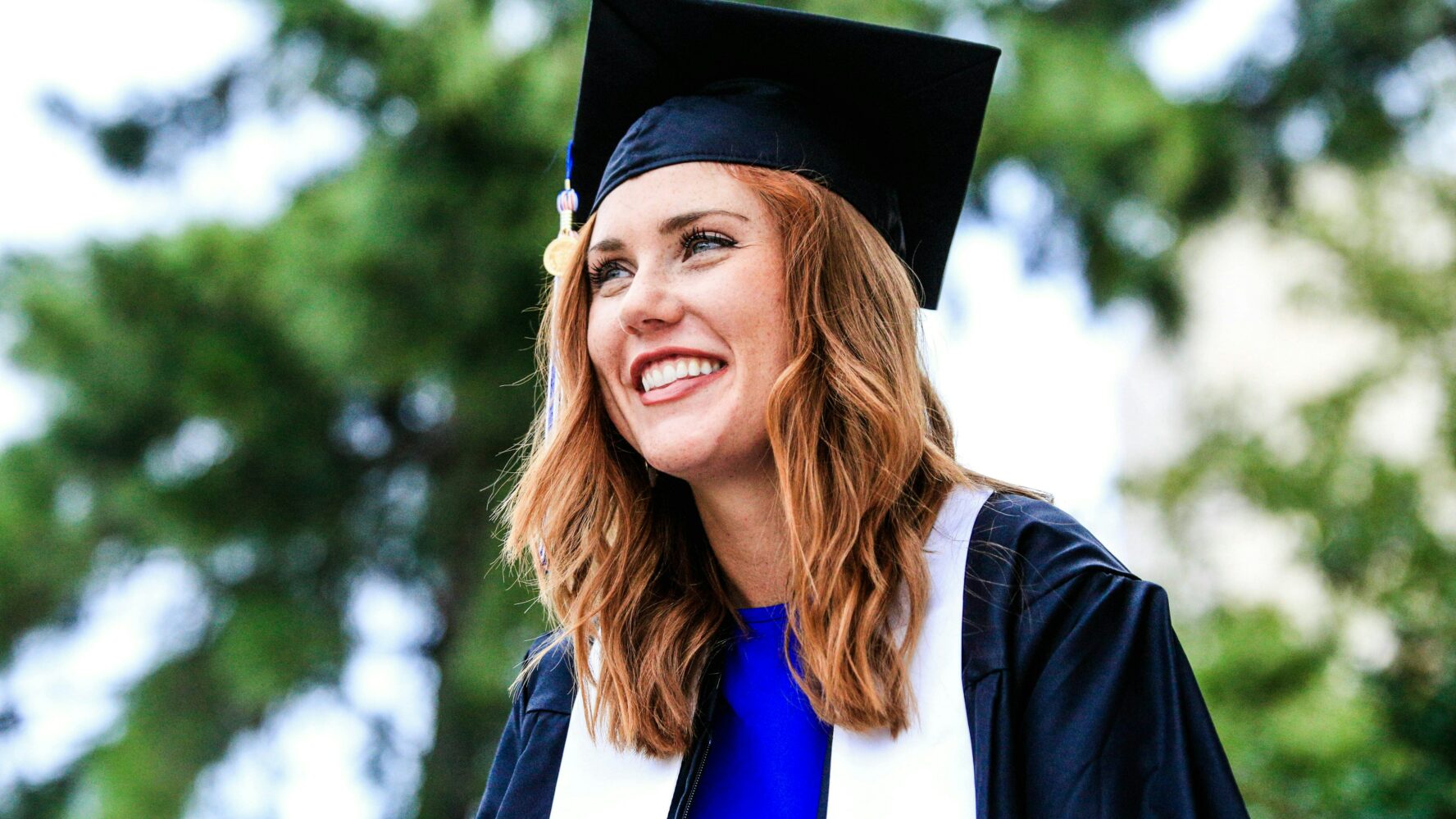 Image showing a female graduate in her gown and cap