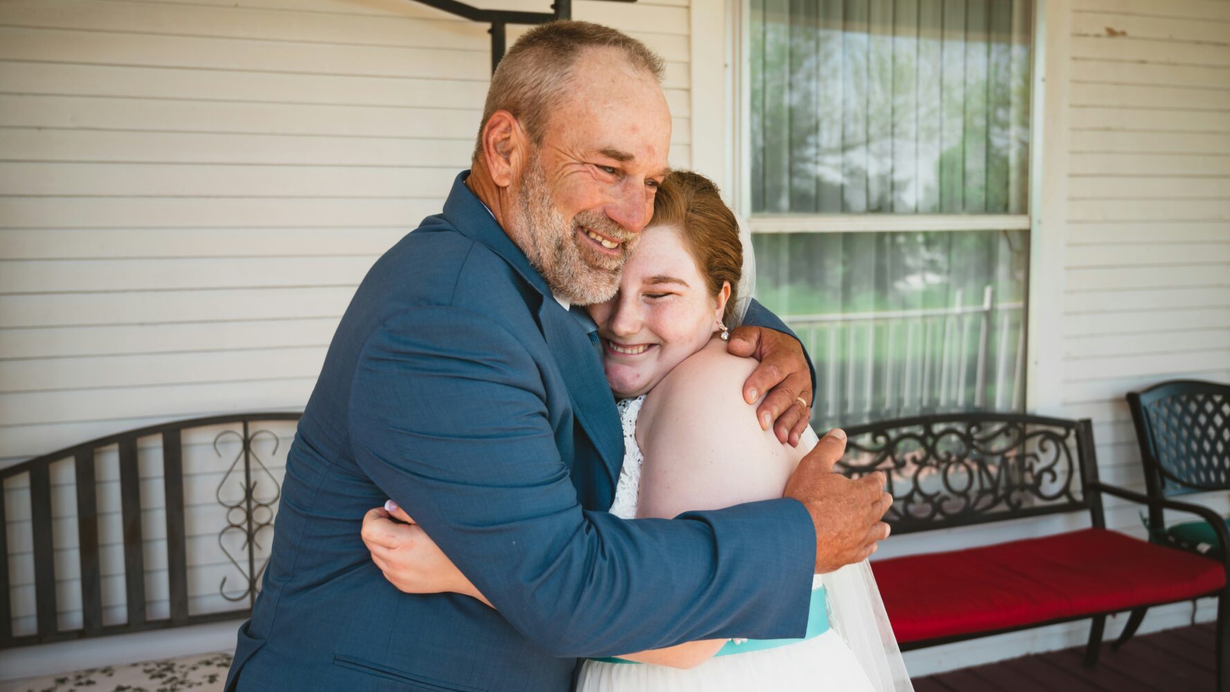 Image of father and daughter hugging