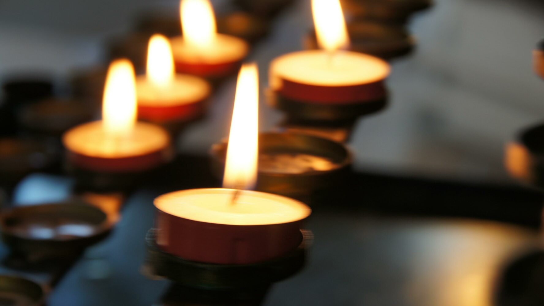 Five tea light candles on a stand