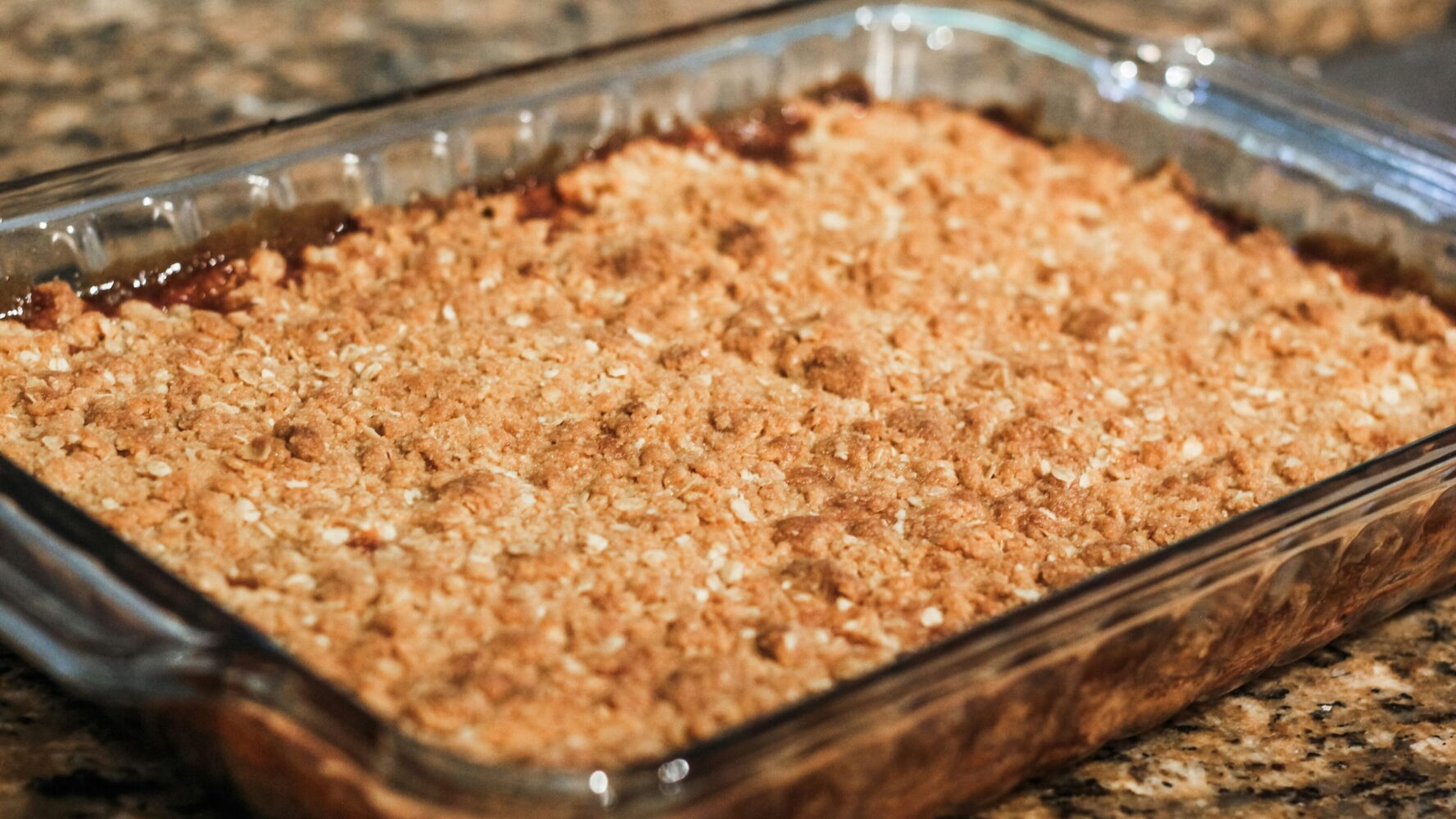 An apple crumble in a baking dish that has been cooked