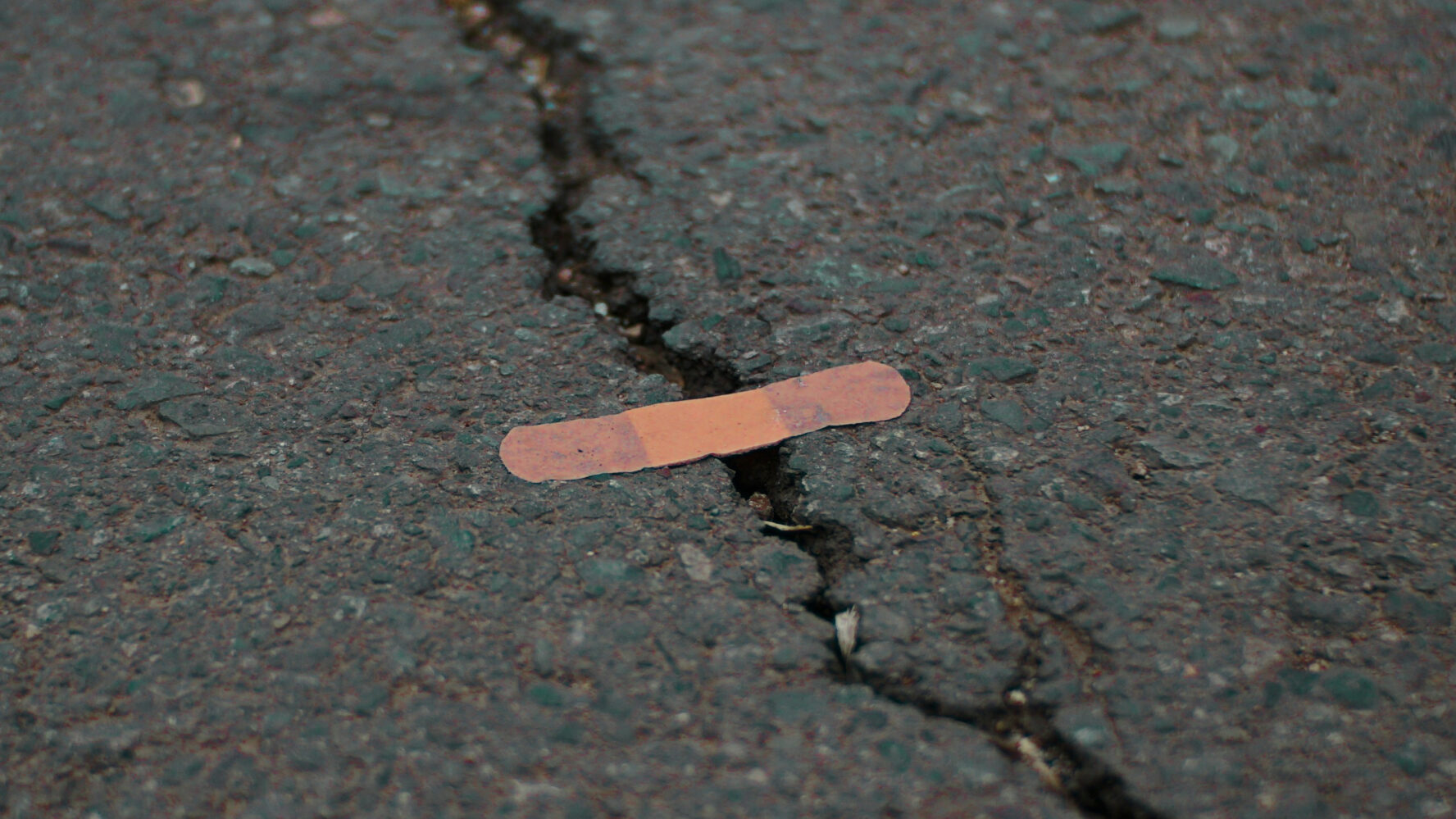 plaster over a crack in the pavement