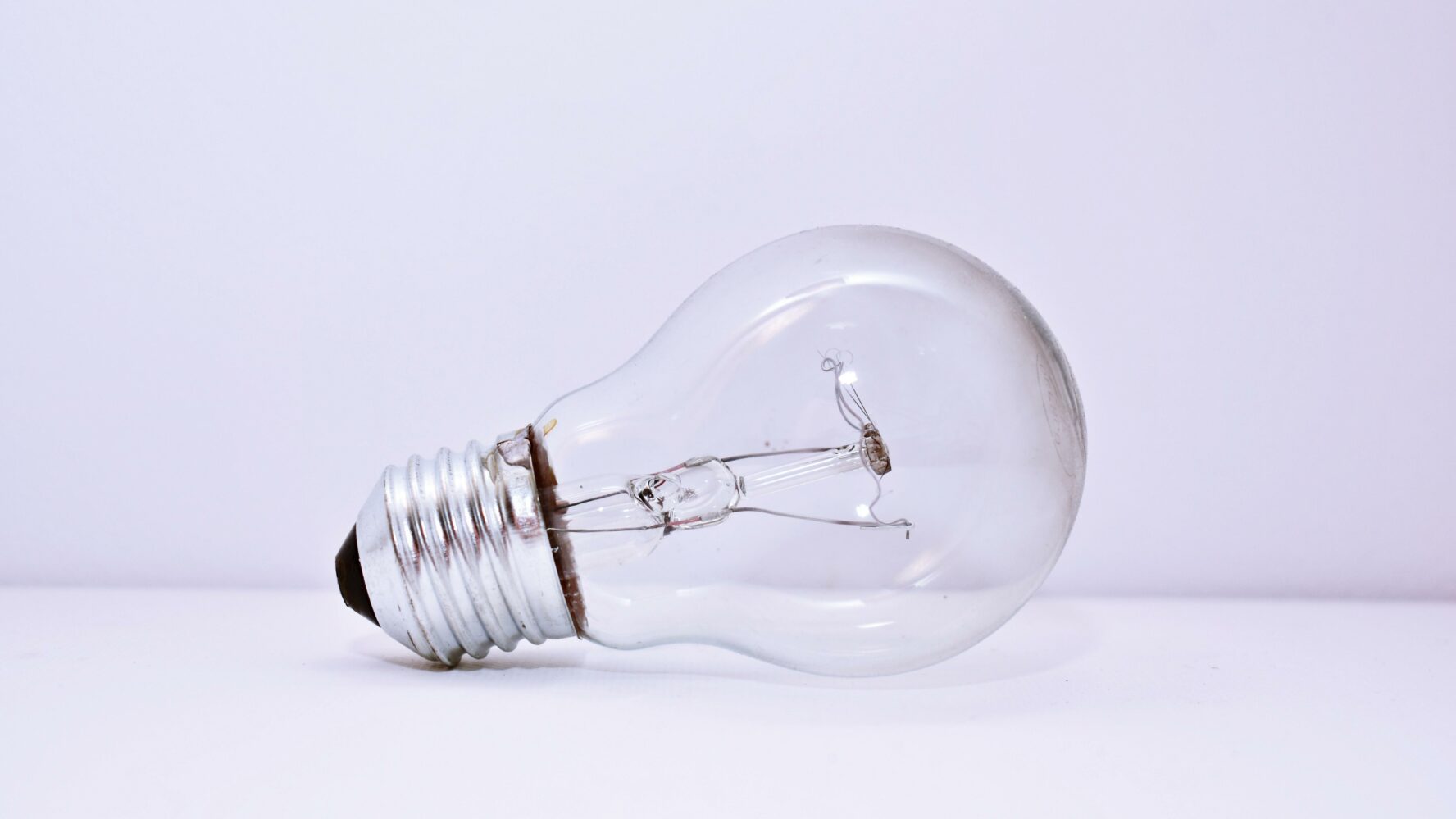 An unlit lightbulb lying on its side.