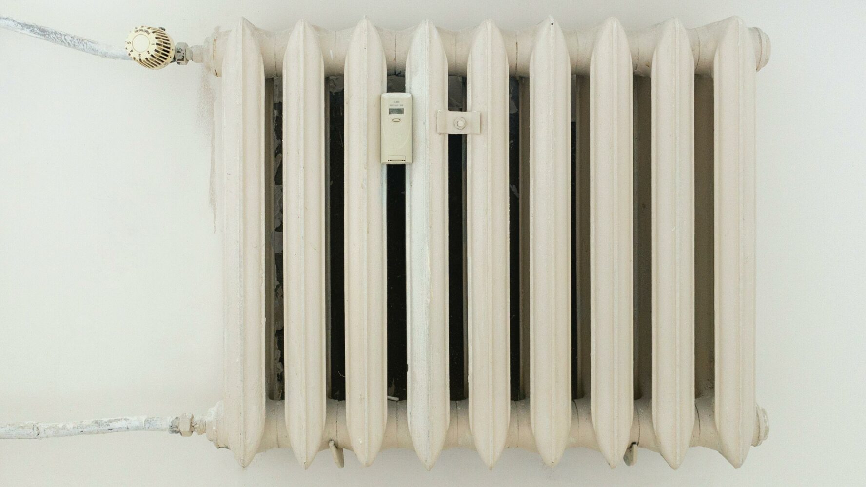 a white radiator mounted on a wall