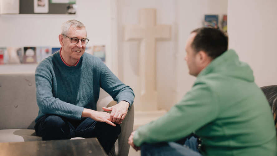 Debt coach Steve, sat talking to a client